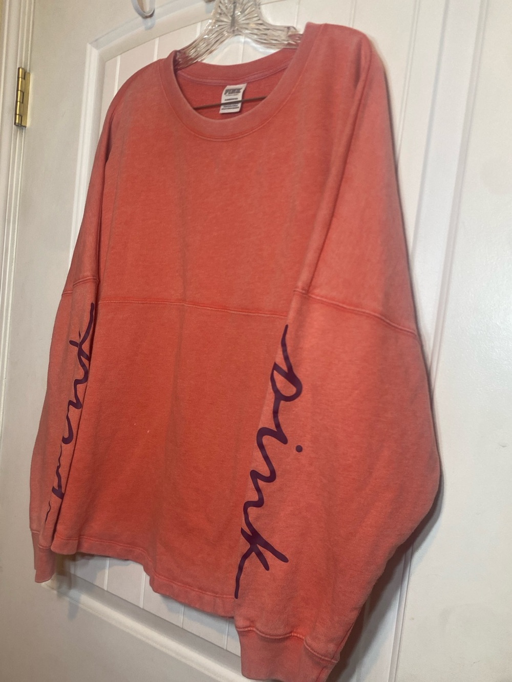 PINK by Victoria Secret Coral colored  Graphic Sleeve crewneck sweatshirt.